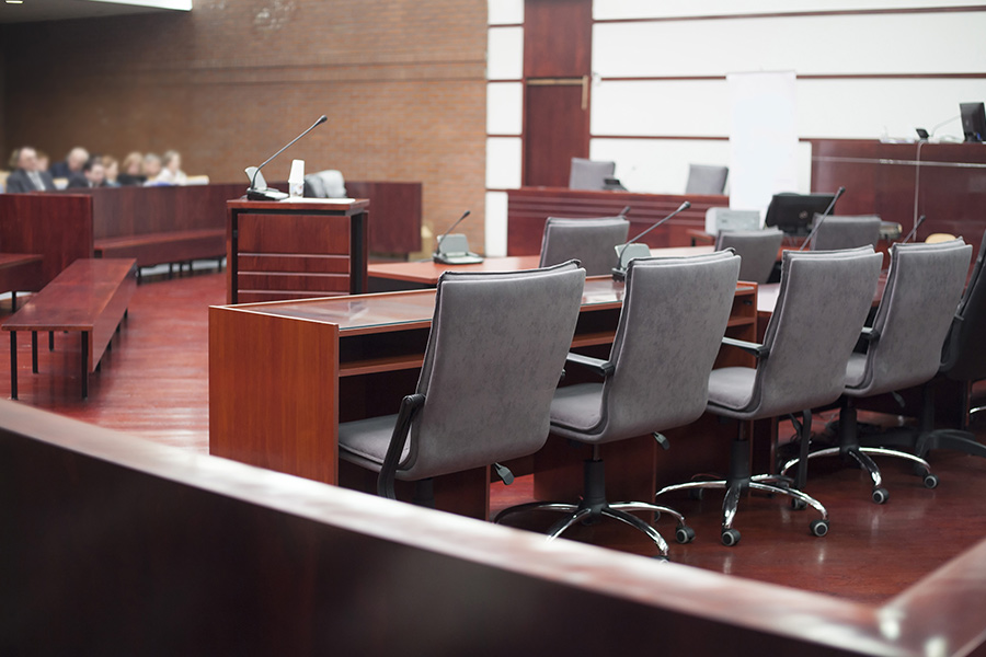 conference room with lots of chairs and microphones