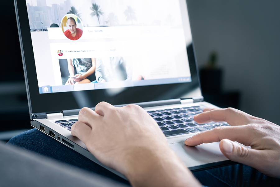 closeup of person typing on laptop keyboard